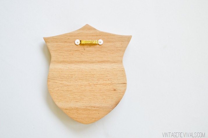 Mounting a picture hanger on a wooden shield