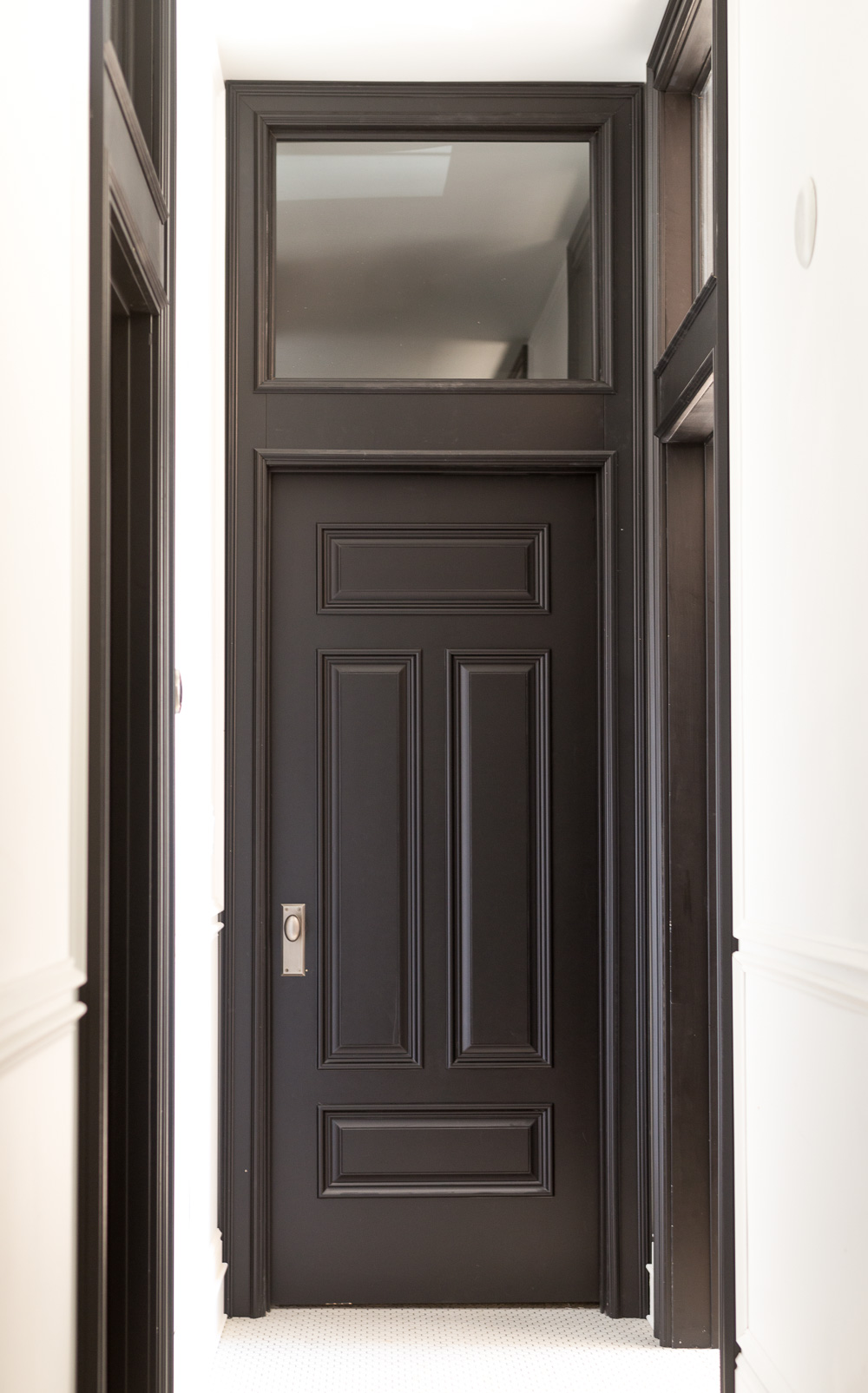 Black Interior Door with Transom and Heavy Moulding