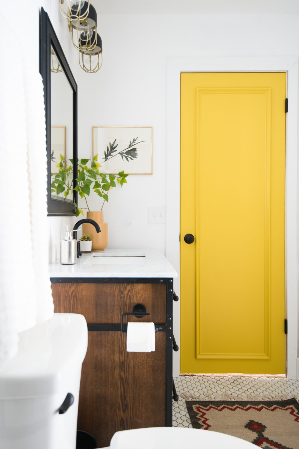 DIY Door Moulding onan eclectic yellow bathroom door from Vintage Revivals